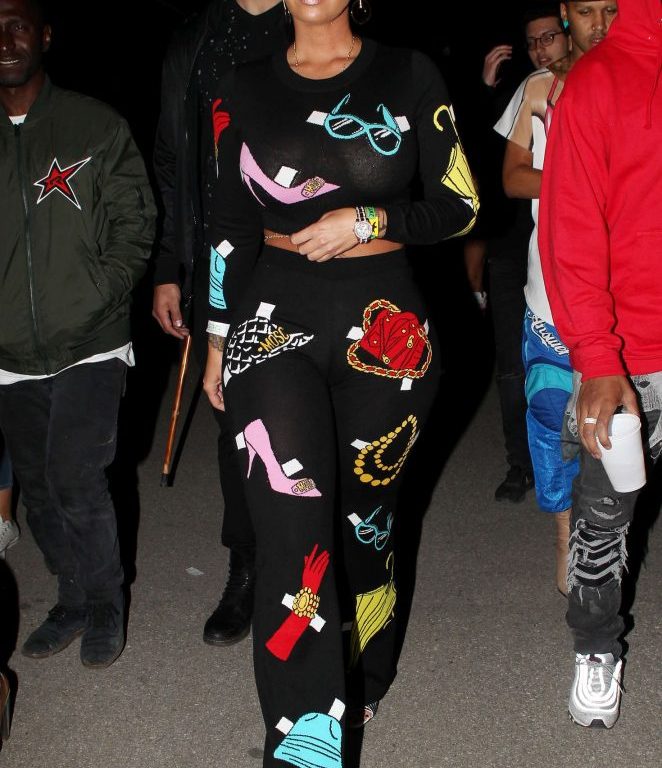 Splurge: Amber Rose’s Coachella 2017 Neon Carnival Moschino $595 Black Graphic Knit Cropped Sweater and $875 Graphic Jersey Flare Pants