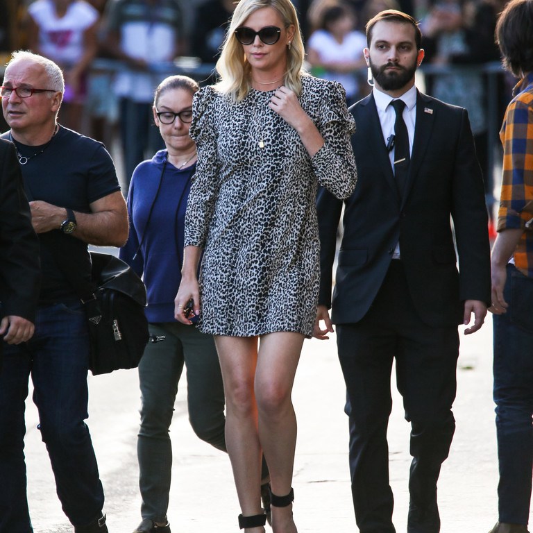 Splurge: Charlize Theron’s Jimmy Kimmel Live $2,590 Saint Laurent Leopard Print Dress and $895 Christian Louboutin Harler Suede Pointed-Toe Pumps