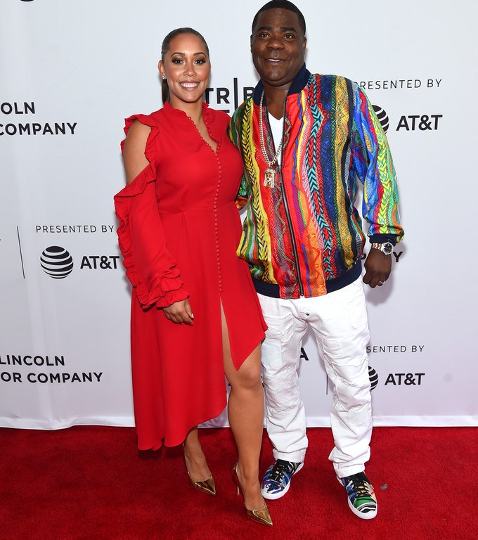 Splurge: Megan Wollover’s <em>The Clapper</em> 2017 Tribeca Film Festival Premiere $1,895 Madga Butrym Red Marbella Asymmetric Ruffled Silk Crepe Midi Dress + Tracy Morgan’s Coogi Silk Bomber Jacket and Sneakers