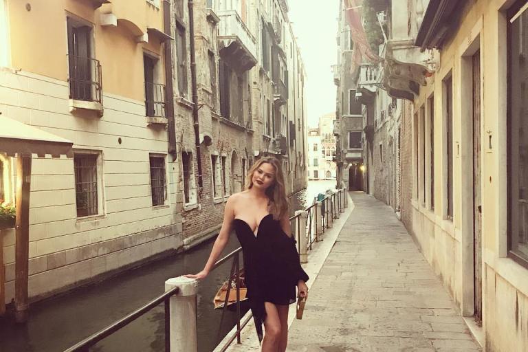 Splurge: Chrissy Teigen’s Instagram $747 Michelle Mason Black Draped One Sleeve Mini Dress