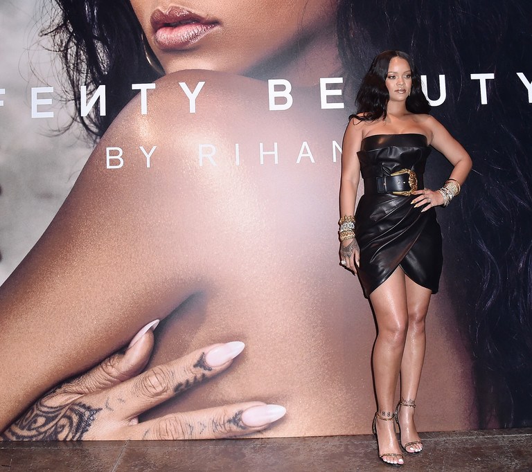 Rihanna Attends Her Fenty Beauty Italy Launch In a Black Strapless Belted Versace FW18 Dress