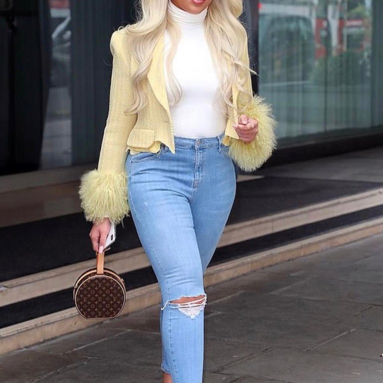 Jordyn Woods Steps Out In London in a Sami Miro Vintage Fur Trimmed Citron Jacket, Jeans, and a Louis Vuitton Purse + Her Myae Made Turquoise Dress!