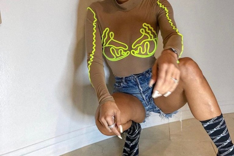 Draya Michele Stunted in This Neon and Mesh Fashion Nova Top