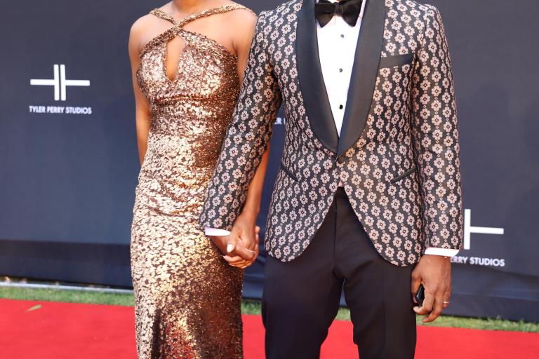 Charlamagne tha God Stunts With His Wife Jessica Gadsden at the Tyler Perry Studios Grand Opening Wearing Alexander Nash Floral Blazer