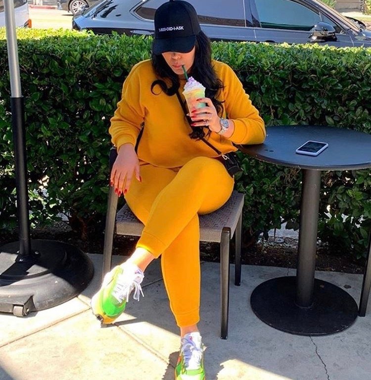 Emily B. Lounges in Style Sporting a Mustard Yellow Joggers Set by Fashion Nova