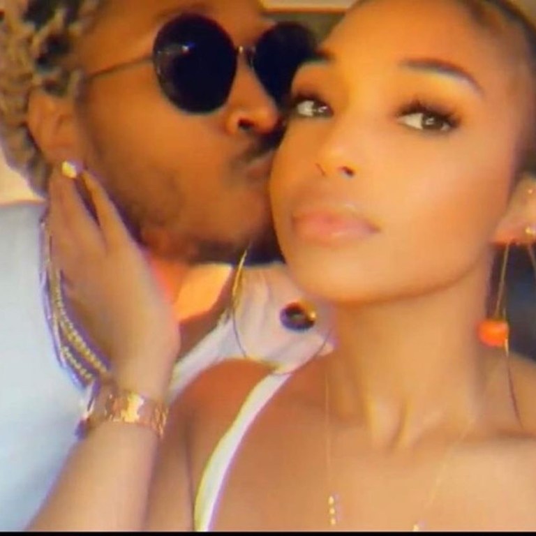 Lori Harvey Wears $100 Pair of Jaquemus Orange and Black Ball Hoop Earrings With Future In Jamaica