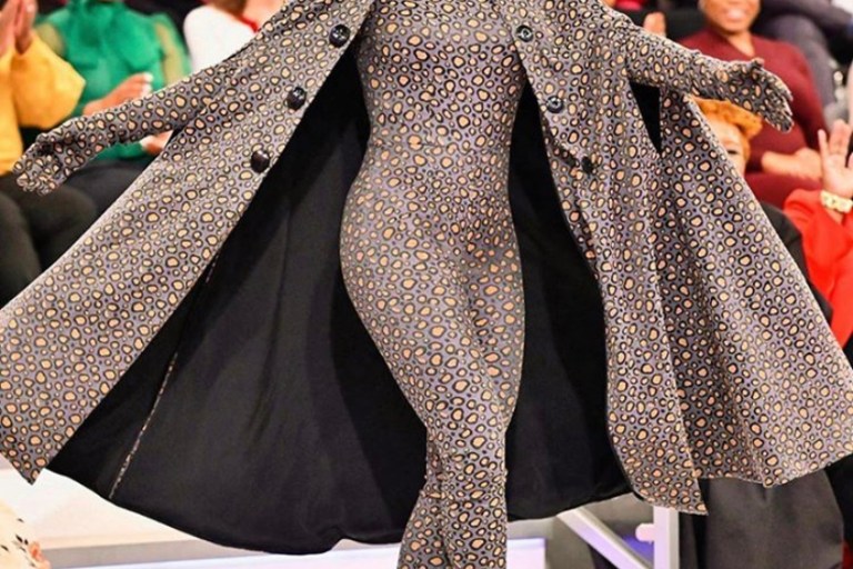 Tamron Hall Wears A David De la Cruz Grey and Yellow Animal Print Cat Suit With Matching Cape on the Tamron Hall Show