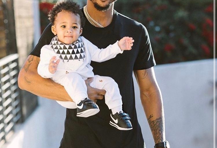 Trey Songz Posed with His Son Noah Songz Wearing Brown and Grey Valentino and Undercover Collaboration Logo Face Shorts
