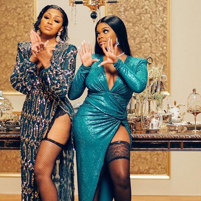 City Girls Pose for a PhotoShoot with JT In an Alexandre Vauthier Aqua Green Dress and Yung Miami in a Michael Costello Embellished High Slit Gown and Jennifer Le Feathered Sandals