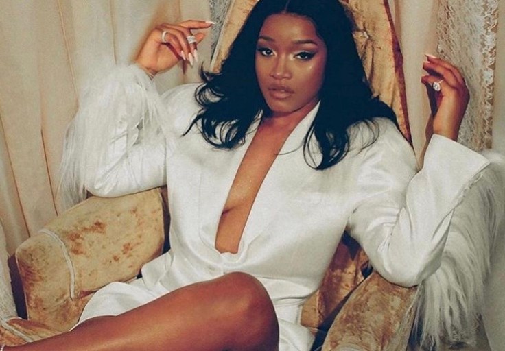 Keke Palmer Posed for a Photoshoot Wearing a White Blazer by Annakiki and Earrings Inspired by Beads By Aree