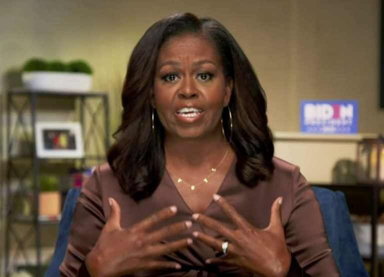 Michelle Obama Delivered a Powerful Speech at the Democratic National Convention in a Nanushka Top and ByChari ‘VOTE’ Necklace