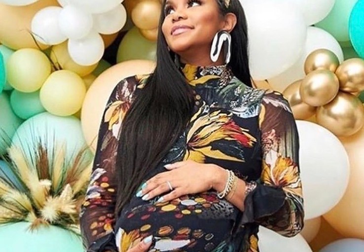 LeToya Luckett Poses at her Virtual Baby Shower in a Jungle Print Ruffle Dress by Fuzzi and Shares Maternity Photos Wearing Pink and Red Georgina dress by Mestiza and More