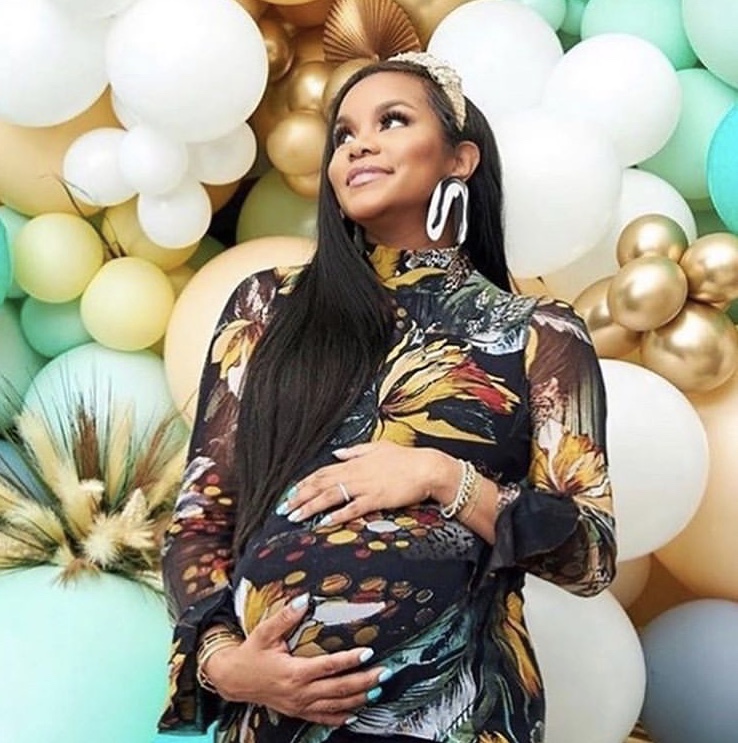 LeToya Luckett Poses at her Virtual Baby Shower in a Jungle Print Ruffle Dress by Fuzzi and Shares Maternity Photos Wearing Pink and Red Georgina dress by Mestiza and More