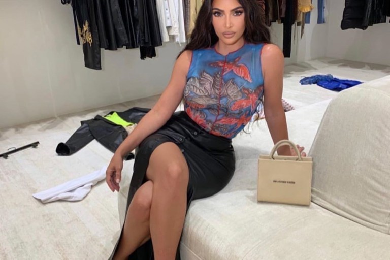 Kim Kardashian Was Spotted with A Noon Top, Nanushka Skirt, Yeezy Sandals and  Brandon Blackwood ‘End Systematic Racism’ Tote