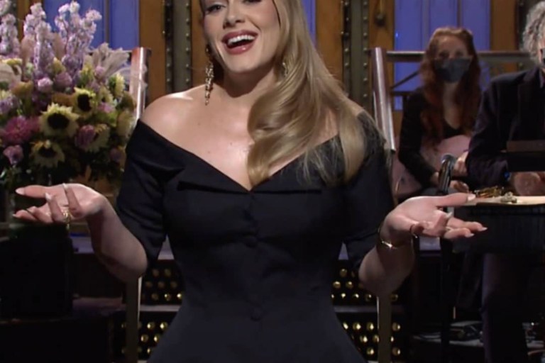 Adele Hosted Saturday Night Live in Valentino FW19 Undercover Print Jumpsuit, Brock Collection ‘Rohtak’ Off-the-Shoulder Wool Jacket, and Acne Studios Gradient Velvet Shirt and Pants
