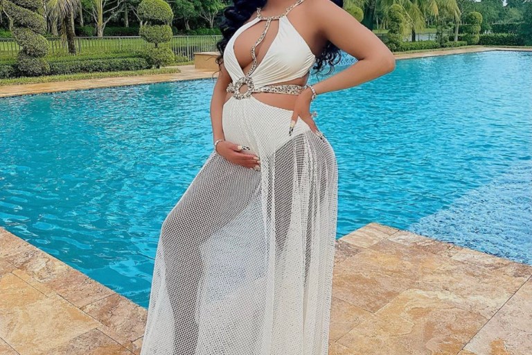 Keyshia Ka’oir Davis Showed Off her Baby Bump in a White PatBO Beaded Cutout Beach Dress
