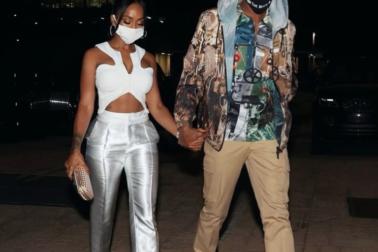 Latoia Fitzgerald Celebrates Los Angeles Lakers Championship With Rajon Rondo in Show-Stopping Look Including White Valery Kōvalska FW20/21 Curved Zip-Up Crop Top and Bottega Veneta Satin Knot Clutch