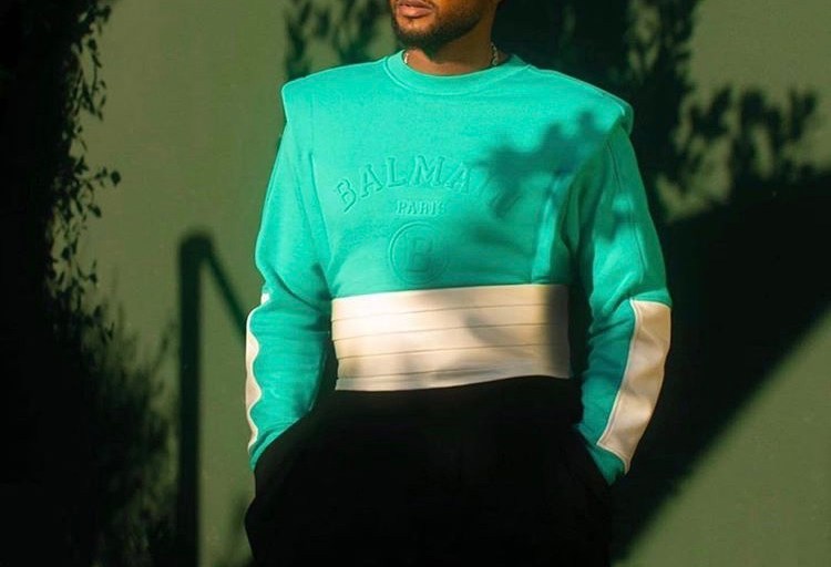 Usher Rocks a Teal, Black and White Balmain Ensemble While Attending Balmain’s Live Stream Show