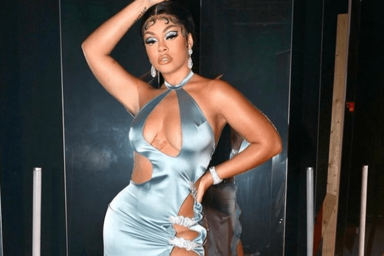 Mulatto Poses in a Seafoam Green Silk Cut Out Dress by Tia Adeola