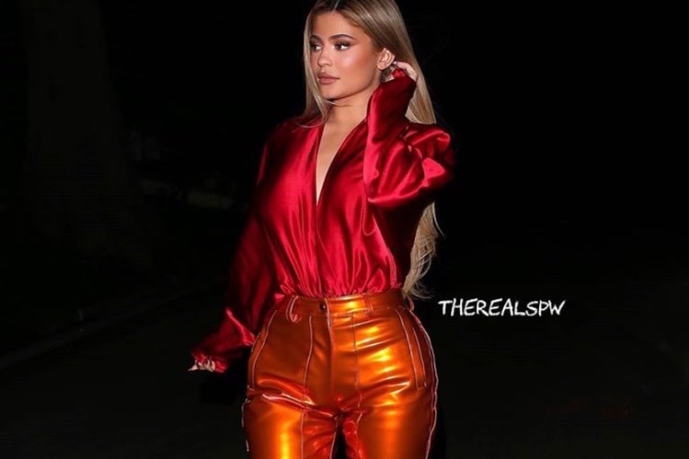 Kylie Jenner wears LaQuan Smith Red Silk Top and Orange PVC Pants While out in Beverly Hills