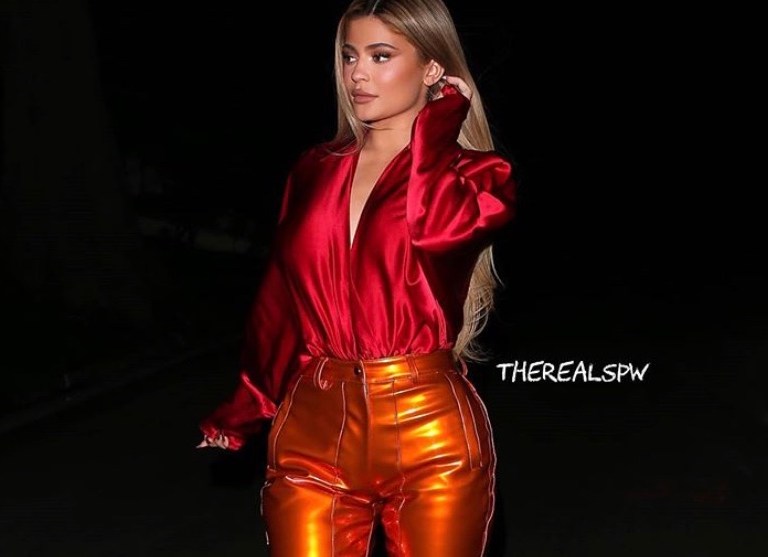 Kylie Jenner wears LaQuan Smith Red Silk Top and Orange PVC Pants While out in Beverly Hills