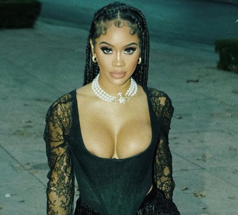 Saweetie Stepped Out in a Vintage Vivienne Westwood Corset, JLUXLABEL ‘Krisana’ Skirt, and Giuseppe Zanotti Platform Heels Accessorized With Gold Vintage Moschino Garter