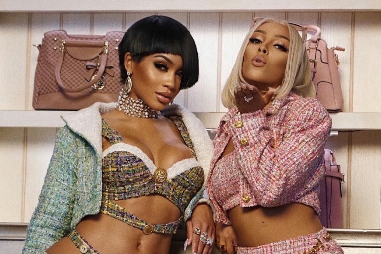 All of the Looks From Saweetie and Doja Cat’s ‘Best Friend’ Video: Custom Green and Red Dapper Dan x Gucci Sets, L.O.C.A and Laroxx Tweed Outfits, Pink and Blue Angel Brinks Velour Suits, + More!