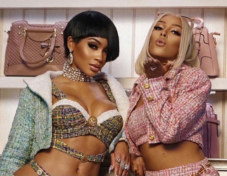 All of the Looks From Saweetie and Doja Cat’s ‘Best Friend’ Video: Custom Green and Red Dapper Dan x Gucci Sets, L.O.C.A and Laroxx Tweed Outfits, Pink and Blue Angel Brinks Velour Suits, + More!