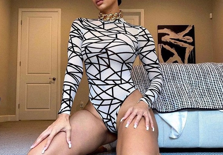 Draya Poses in Fashion Nova’s Black and White Mesh Bodysuit