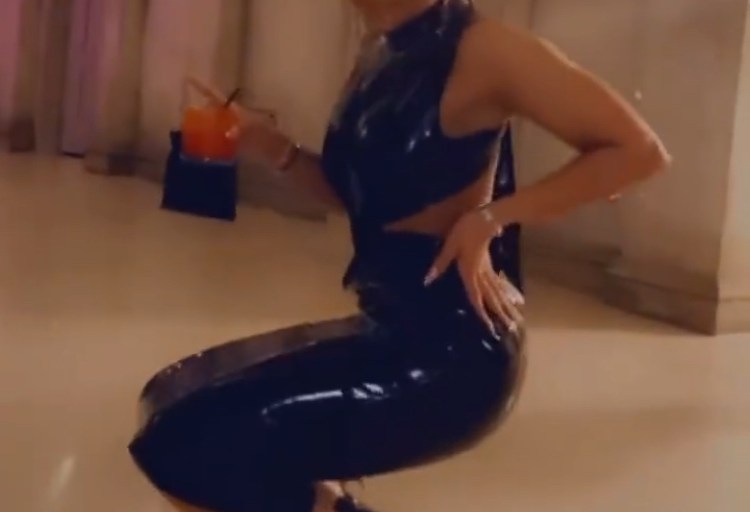 Lori Harvey Danced Wearing A Black Latex Dress by YSL and Louboutin Leather Sandals