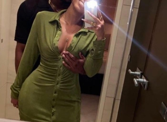 Lori Harvey is All Smiles With Michael B. Jordan Wearing A Green Button Dress From With Jean