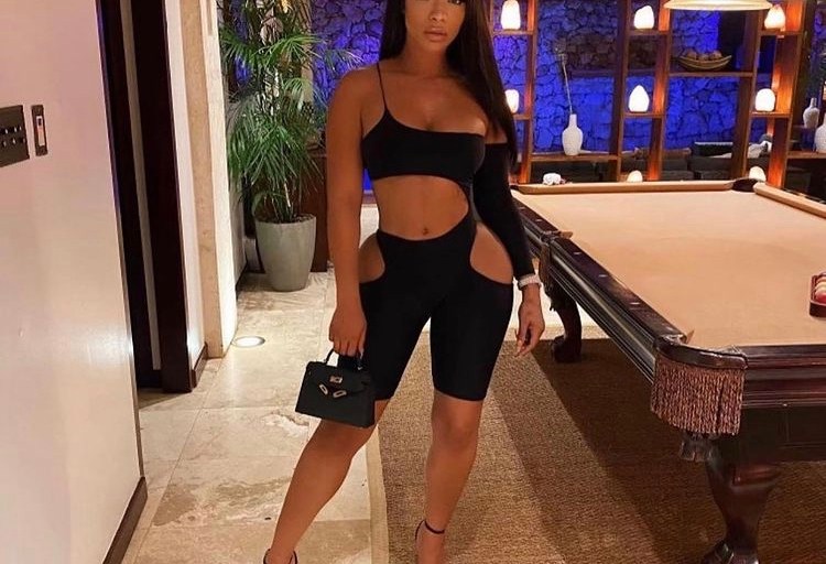 Tommie Accented Fashion Nova’s Black Romper with Tom Ford Pad Lock Heels