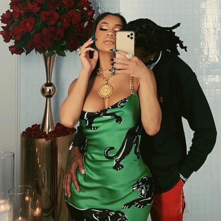 You Ask, We Answer! Saweetie’s Valentine’s Day Green Olivia von Halle Black Panther Print Chain Strap Dress
