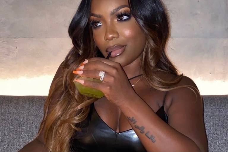 Tiarra Monet Spotted in Elevyn Thirty Black Leather Triple Strap Midi Dress During Date Night With Husband Tim