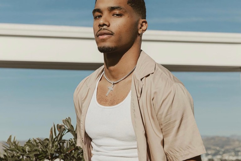 Actor Rome Flynn Brings the Heat in Fashion Nova Taupe Short Sleeve Woven Button-Up Top