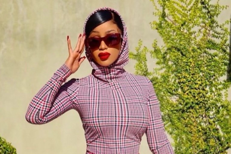 Cardi B Announces the Launch of Her Doll With ‘Real Women Are’ Wearing Burberry Look Including Houndstooth Check-Print Hooded Top and Matching Mini Skirt With Tartan Nylon and Leather Bag