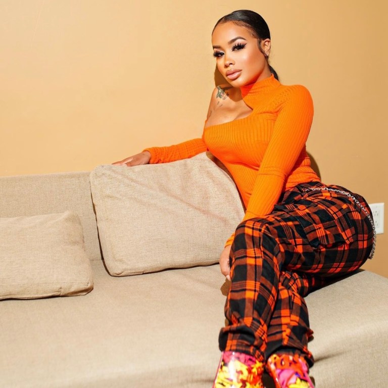 DreamDoll Keeps It Cute and Stylish in Fashion Nova Orange Plaid Joggers