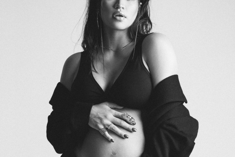 Cassie Flaunts Her Growing Baby Bump in New Maternity Shoot Wearing Black Vintage YSL Coat and Black Intimates by Commando Paired With Ariana Boussard-Reifel and GhostLine Accessories