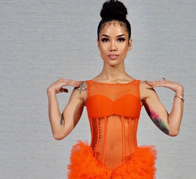 Jhené Aiko Brings In Her Birthday With Epic 2021 Grammys Performance Wearing Custom Jovana Louis Orange Tulle Gown