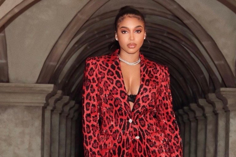 Lori Harvey Celebrates Best Friend Nikki Hightower’s Birthday Wearing Tom Ford Red Jaguar Print Suit and Hermes Black Mini Kelly 20 Croc Bag