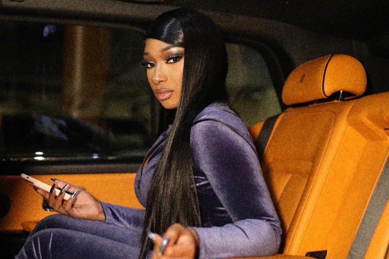Megan Thee Stallion Gets Ready for 2021 Grammys in Fashion Nova Navy Velour Track Suit