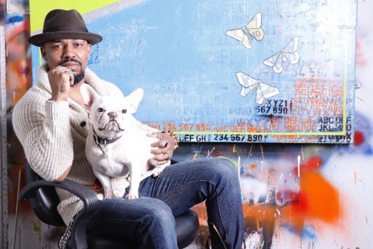 New York’s Haitian Artist Guy Stanley Philoche Is Giving Back to the Community, Purchases $70K Worth of Art From Global Emerging Artists + Teams Up With Vans for Limited Edition Sneaker to Help Small Businesses Affected by COVID-19