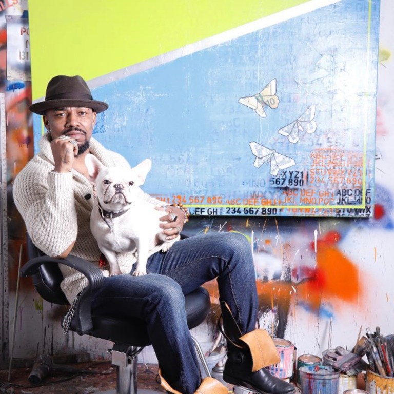 New York’s Haitian Artist Guy Stanley Philoche Is Giving Back to the Community, Purchases $70K Worth of Art From Global Emerging Artists + Teams Up With Vans for Limited Edition Sneaker to Help Small Businesses Affected by COVID-19