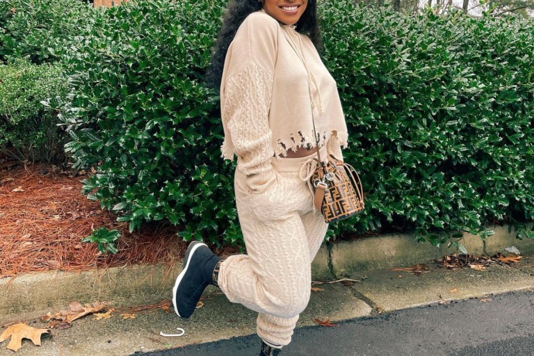 Reginae Carter Keeps It Cozy and Casual in Fashion Nova Cream Distressed Cable Knit Two Piece Set