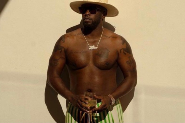 Wardrobe Inquiry: Diddy Spotted Vacationing in the Bahamas Wearing Issey Miyake White Button Long Sleeve, Dries Van Noten Multicolor Striped Pants, Tom Ford Brown Thong Logo Sandals and Nick Foquet White Straw Hat