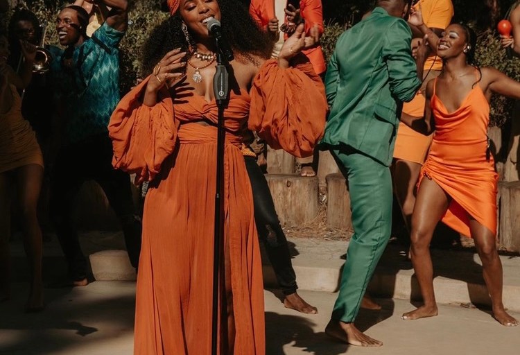 You Ask, We Answer! Kelly Rowland Performed for The Ellen Show Wearing Bronx and Banco Spring/Summer 2021 Rust Off-the-Shoulder Bralette Top, Maxi Skirt and Headband Set