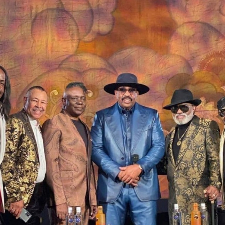 Earth, Wind & Fire and The Isley Brothers Verzuz TV Fashion: Verdine White in Custom Richfresh White and Red Suit, Ron Isley in Dolce and Gabbana Metallic Jacquard Suit, Ernie Isley in For The Stars Fashion House White Gold-Studded Leather Jacket + More