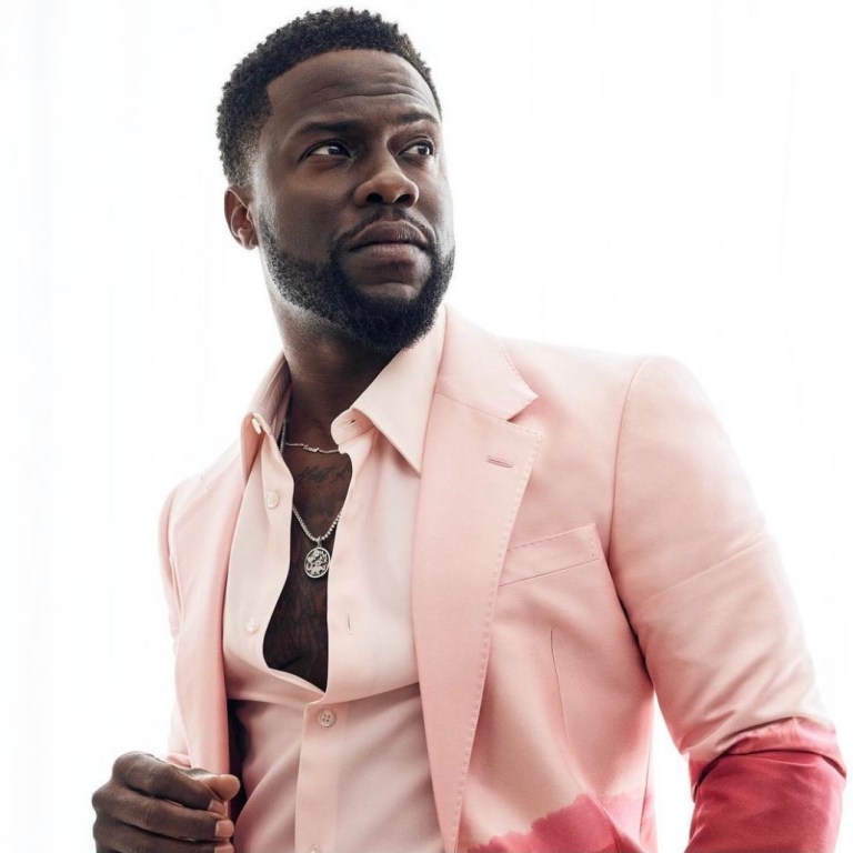 Kevin Hart Channels His Inner Swagger for a Photoshoot in Dapper Alexander McQueen Spring 2021 Pink-Red Dip-Dye Suit + More Looks Featuring Lanvin Stripe Polo Shirt and Green Trousers and Custom FRÈRE Grey Suit