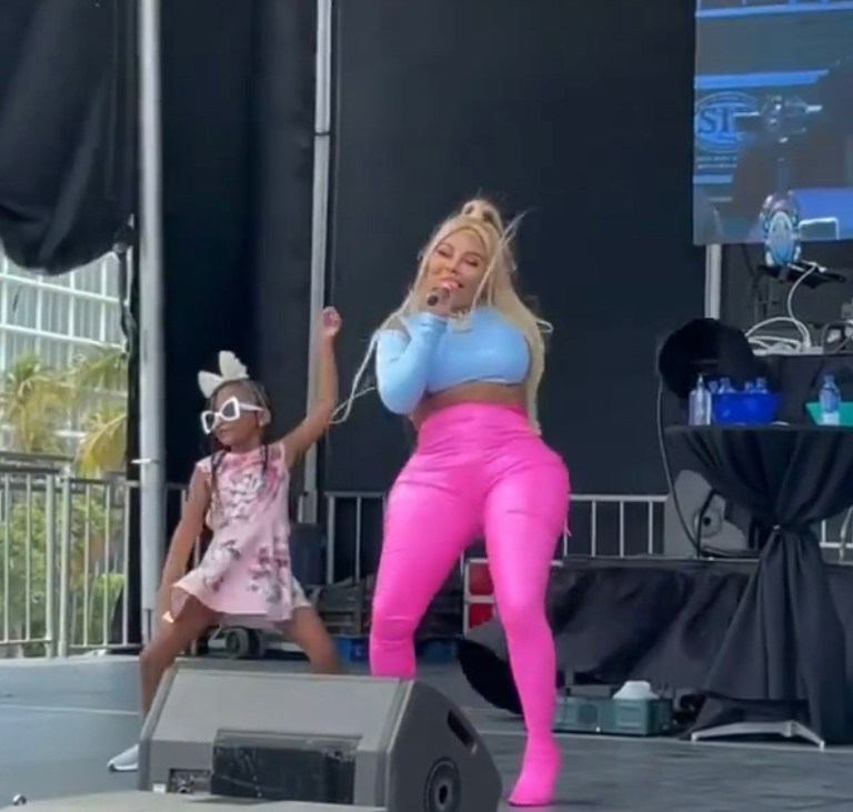 Lil Kim Performs at Florida Aids Walk with Daughter Royal Reign and Trina in Custom Geche Escvar Blue Top and Pink Pant / Boots