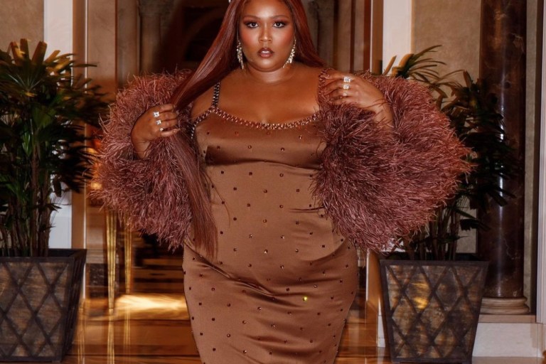 Lizzo Celebrates Her Birthday in Vegas With Glamorous Looks Including Norma Kamali Sleeveless Ruched White Dress, Roberto Cavalli Fall 2021 RTW High-Low Embellished Dress and Dolce and Gabbana Custom Brown Jeweled Dress